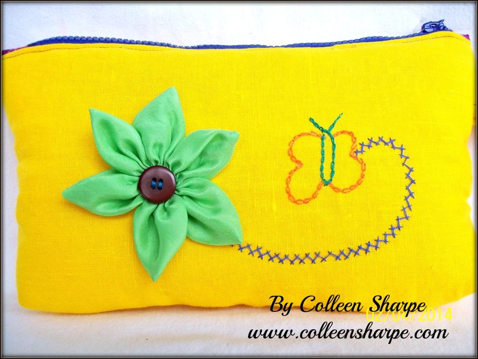 upcycled yellow linen fabric bag with green silk flower and embroidered butterfly